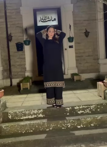 video of model wearing the Verso Polo Neck Long Length Top & Trousers Co-ord Set in black